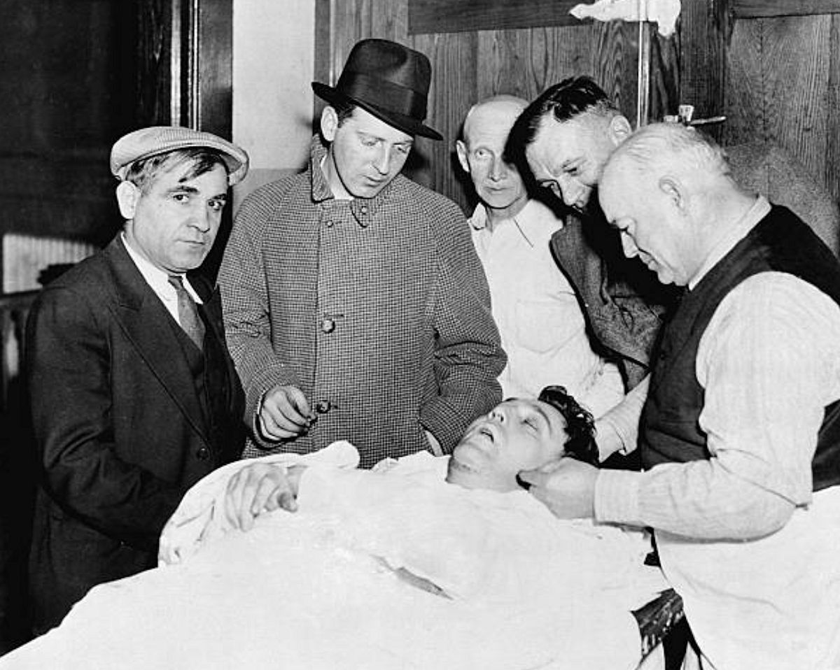 In the Morgue
Bronx Beer Baron Bows Out. He beat many a rap, local, state, and Federal, but Arthur Flegenheimer, known as 'Dutch Schultz' big as he was, could not escape gangland justice. Here he is on a slab in the morgue of a Newark, New Jersey hospital.

Photo from Bettmann
