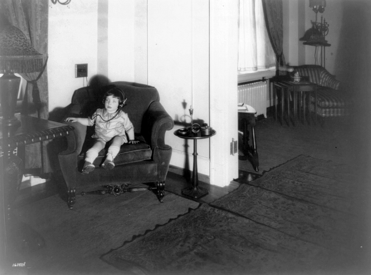 Gross, Morty
Morty Gross using Western Electric headset to listen in on Man in the Moon stories, Ritz Apartments, Newark, N.J.
From “Library of Congress”

