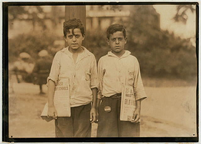 Eddie and Carmine Zizza, twelve year old twins who make $1.50 a day. They belong to a family of 13 children many of them newsboys. Newark, N.J. - August 1st, 1924.
