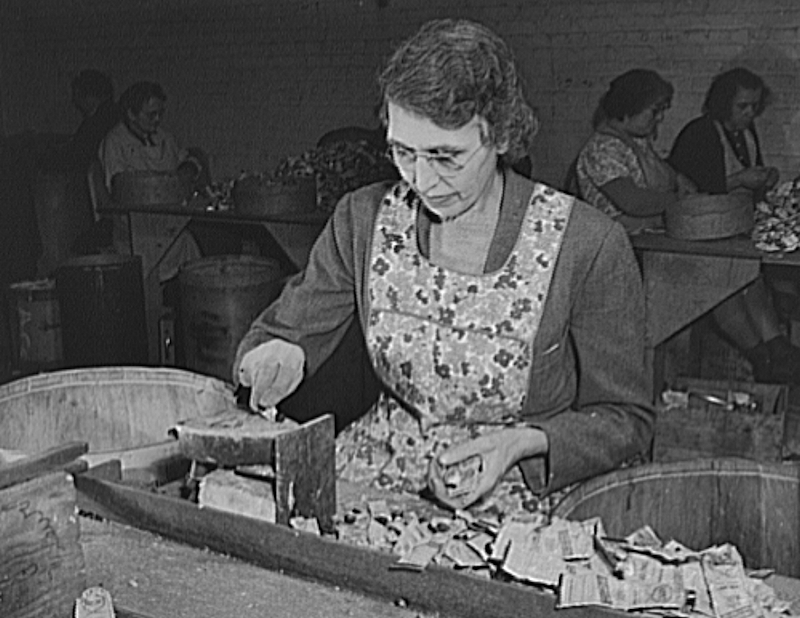 Lewis, Madge
Empty collapsible tubes: a tin mine for war industry. Mrs. Madge Lewis, widow and ex-sales lady, tests old tooth paste and other tubes for metal content in the Newark, New Jersey reclamation plant of the Tin Salvage Institute. This test on an electric iron helps to identify tin and lead tubes from containers made of other metals

From “Library of Congress”
