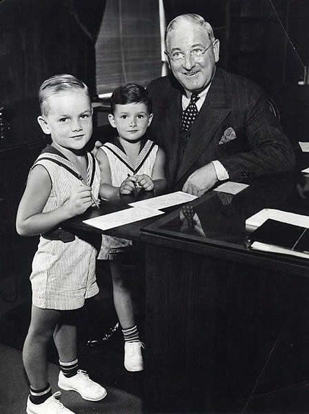 Tighe, John C. & Dick
These are my cousin's, Jack and Dick Tighe with the "new" head of the Social Security Dept here in New Jersey back around 1936 when Social Security first came about.  They were both model's for various newspapers and magazines and stores in this area including Bamberger's.  They were the first children in this area to have received a Social Security card.

Photo from Jule Spohn

